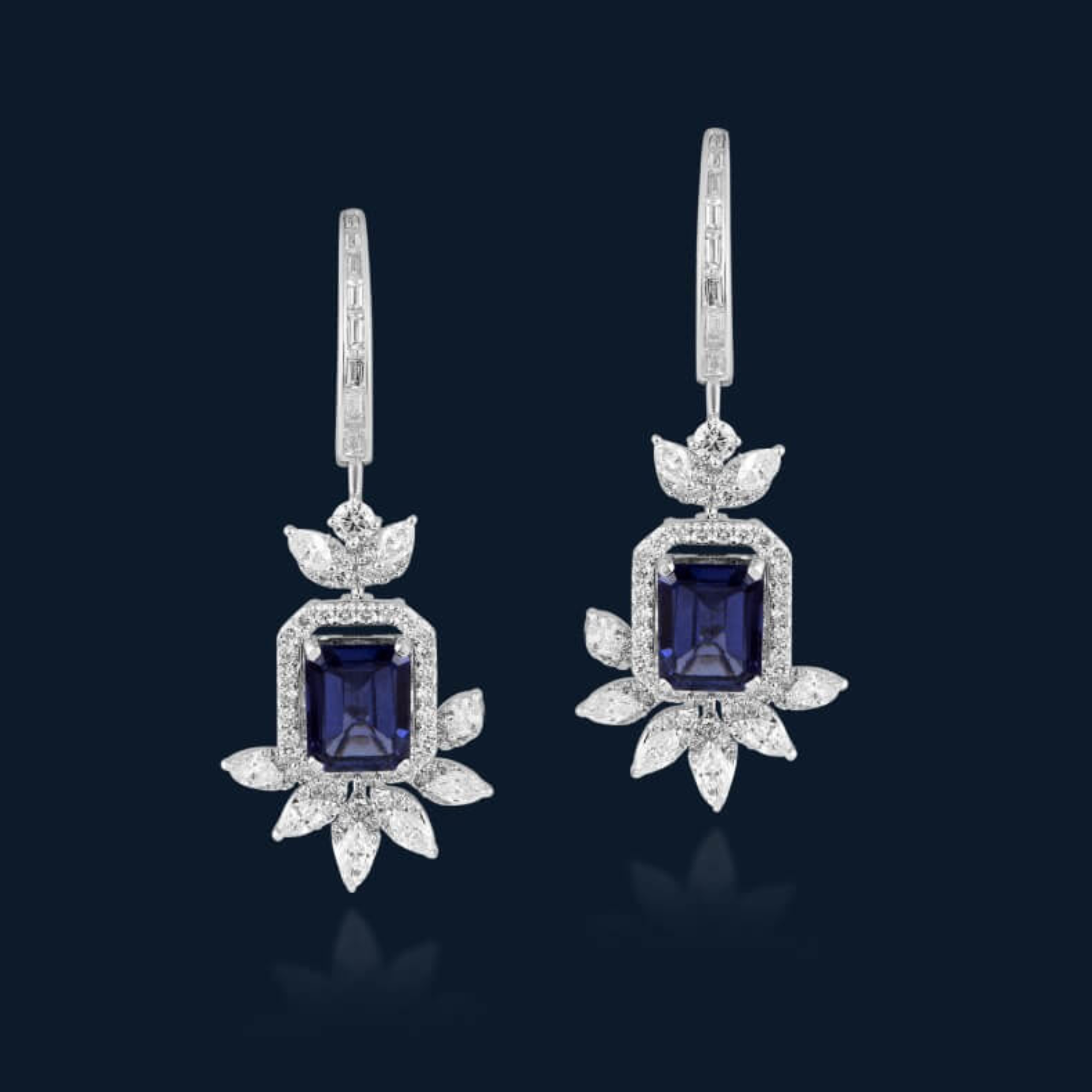 Earrings in 18kt white gold with Marquise, Bagguetts & Round Brilliant cut diamonds studded with semi-precious blue gemstone