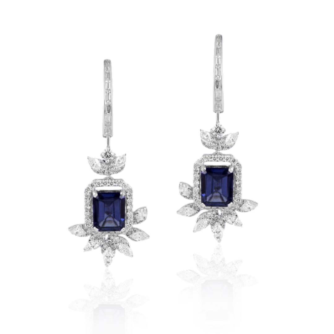 Earrings in 18kt white gold with Marquise, Bagguetts & Round Brilliant cut diamonds studded with semi-precious blue gemstone