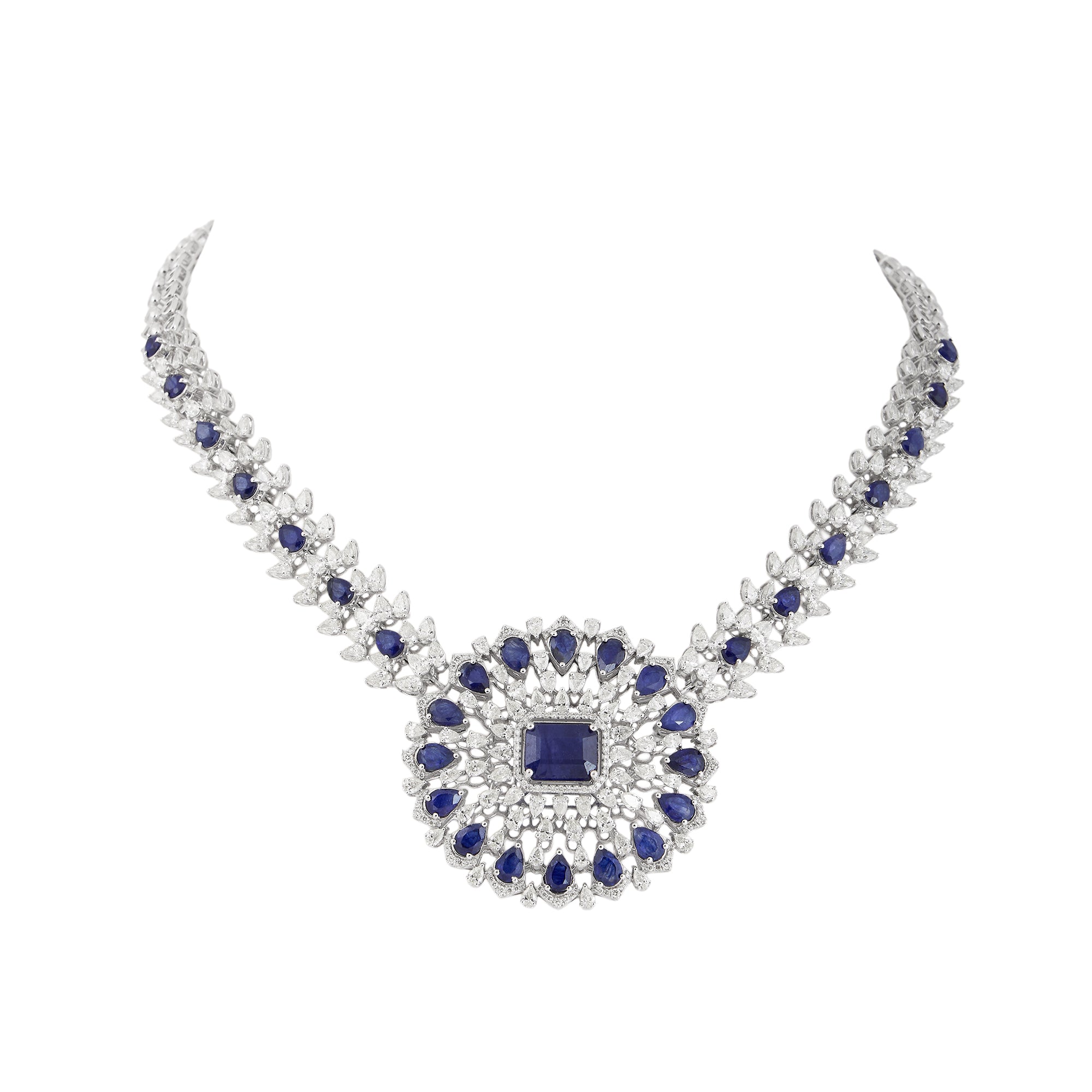 Necklace set in 14kt white gold with brilliant round and pear shaped diamonds.