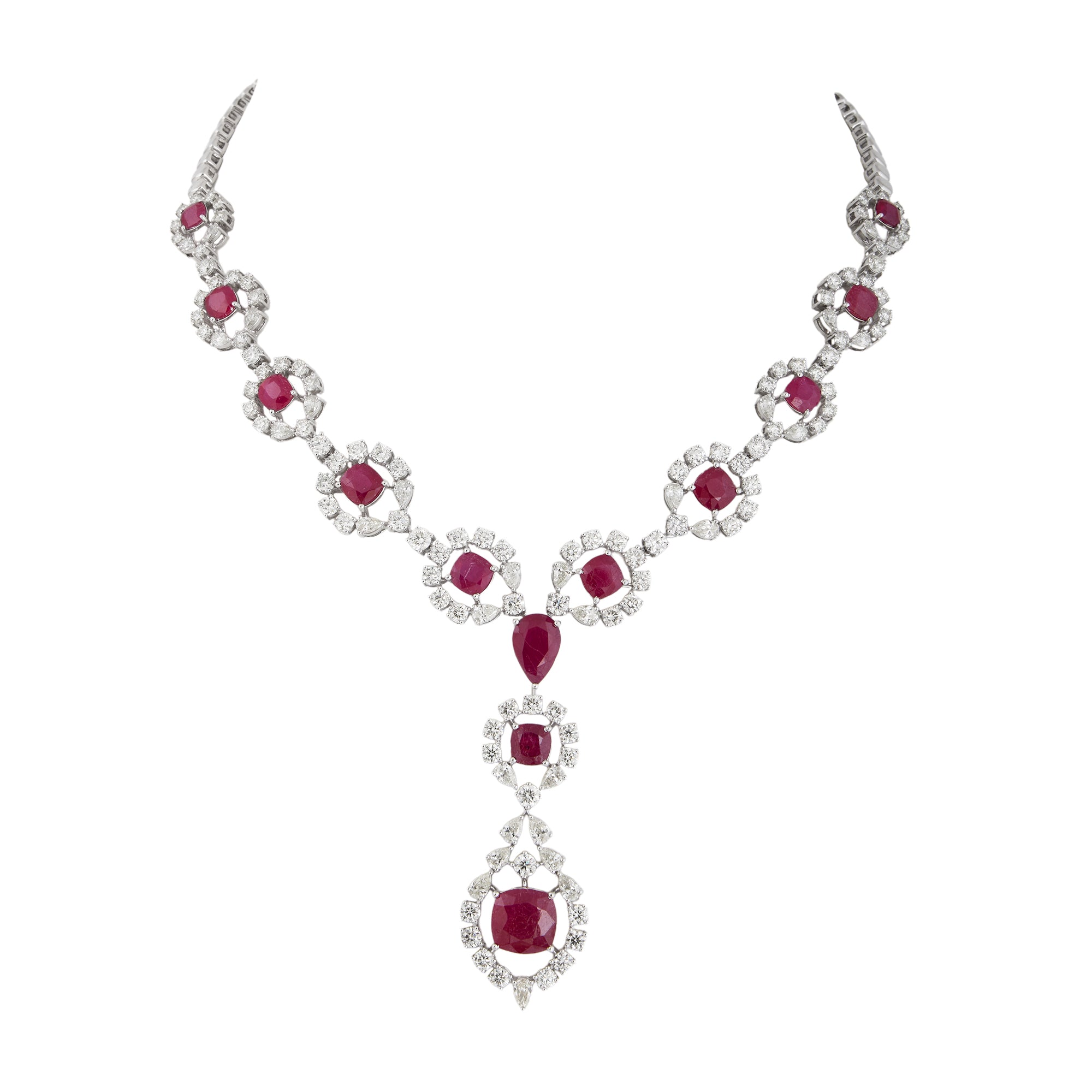 Necklace set in 14kt white gold with brilliant round, precious ruby and pear shaped diamonds.