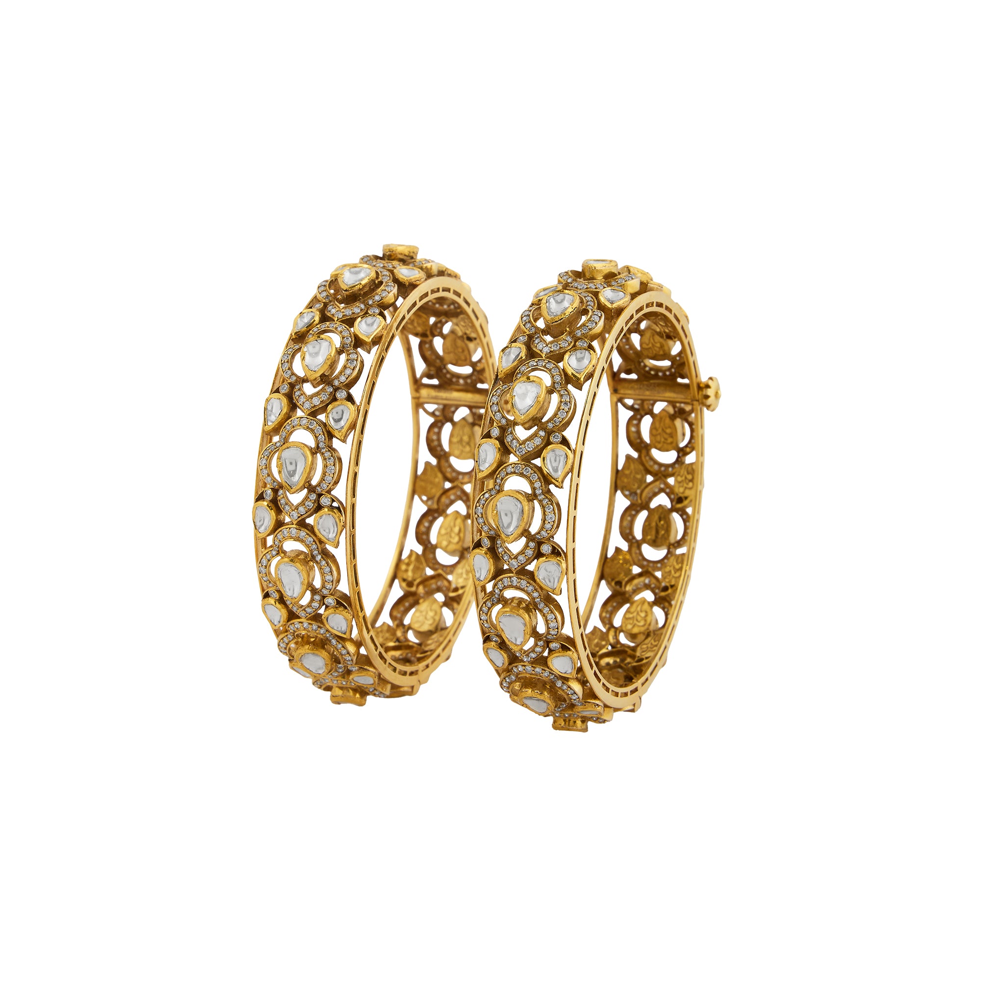Polki diamond antique bangles in 14kt yellow gold with brilliant round diamonds.