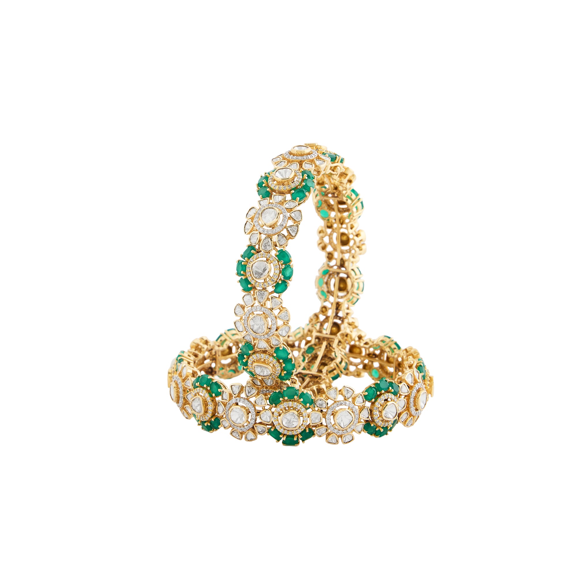 Polki diamond bangles in 14kt yellow gold with brilliant round diamonds and semi precious emerald.