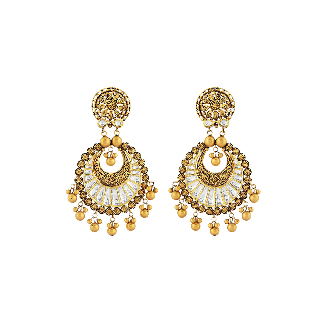 Earrings in 22kt Antique gold, with kundan touch.