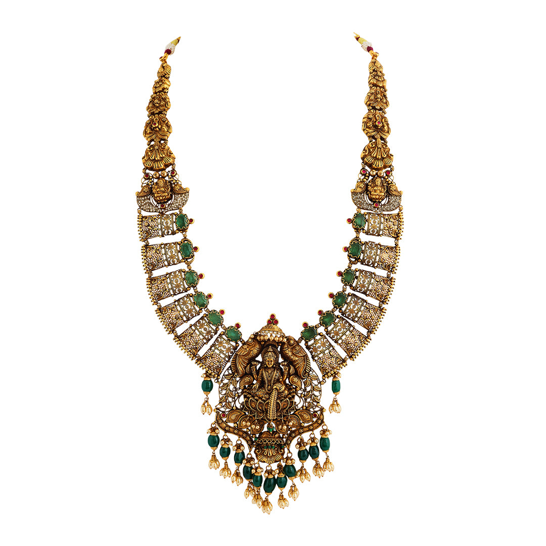 Necklace set in 22kt temple Antique gold, with emerald and pearl.