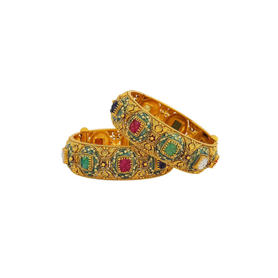 Kada in 22kt Antique gold with ruby, emerald, and blue sapphire.